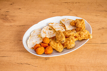 Mushroom croquettes, synchronized quesadillas and battered chicken wings