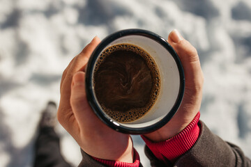 hiker drink coffee in mountains