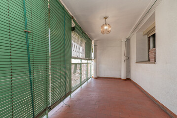 closed terrace with aluminum and glass with green shutters