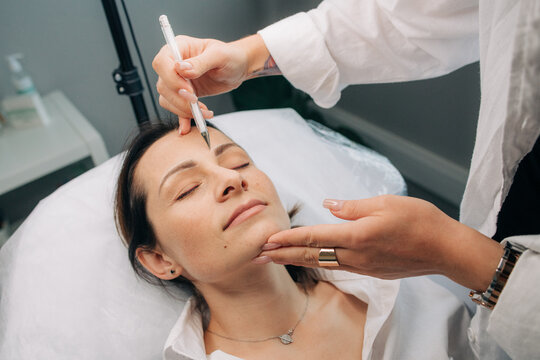 Esthetician working with a client