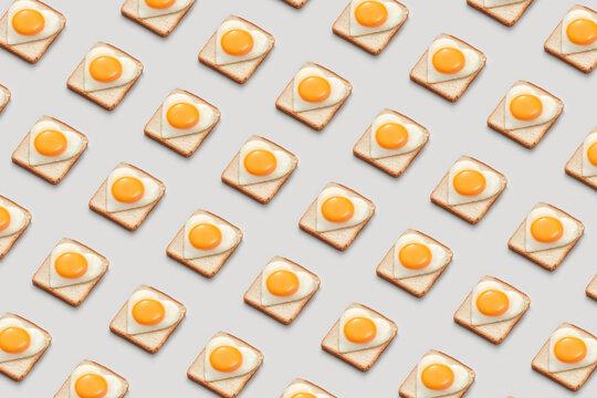 Pattern of toasts with heart shaped eggs