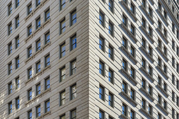 the corner of a white building taken from below