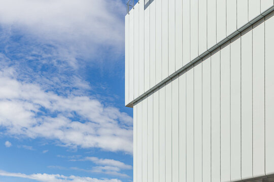 minimal white building with vertical lines