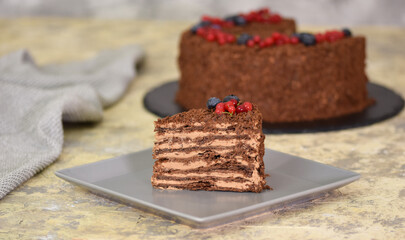Piece of Chocolate Napoleon cake. Chocolate cake with berry.