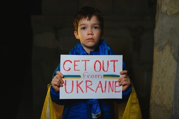 Russia's war against Ukraine in 2022. A sad boy is hiding in a bomb shelter from Russian missiles. Stop the war.