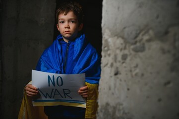 war russia against ukraine, the boy holds an inscription against the war. Stop killing children