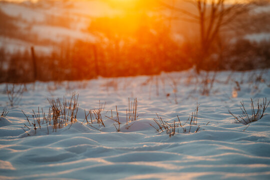 Sunset Over Snowy Field