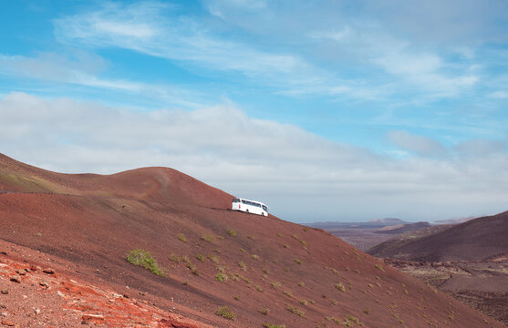 Bus tour across volcanic mountains
