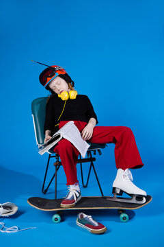 Exhausted multitasking kid sleeping in studio