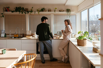 Content couple preparing breakfast together