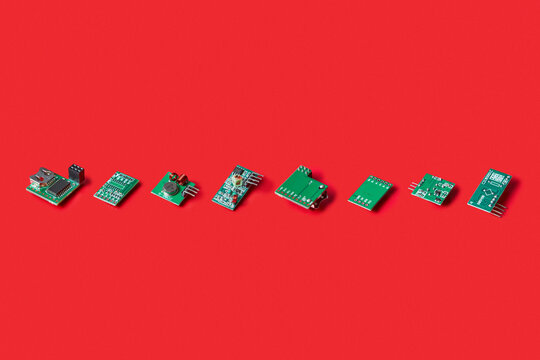 Line of electronic microchips on red background