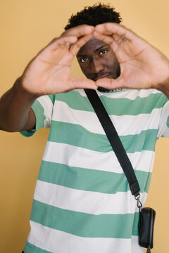 Stylish Man Portrait In Yellow Background