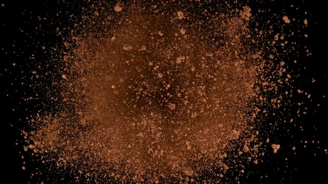 Super slow motion of ground coffee powder rotation on black background. Filmed on high speed cinema camera, 1000fps. Speed ramp effect.