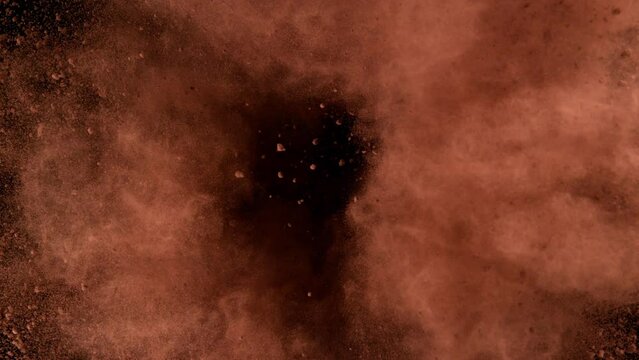 Super slow motion of ground coffee powder rotation on black background. Filmed on high speed cinema camera, 1000fps. Speed ramp effect.