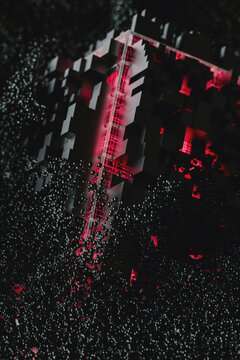 Pink Tech cube surrounded by electromagnetic particles