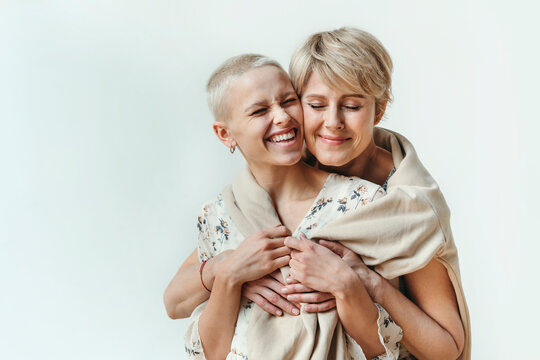 Happy hugging women.