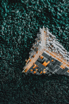 Orange Tech cube surrounded by electromagnetic particles