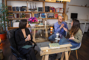 Irritated couple quarrelling at meeting with sexologist