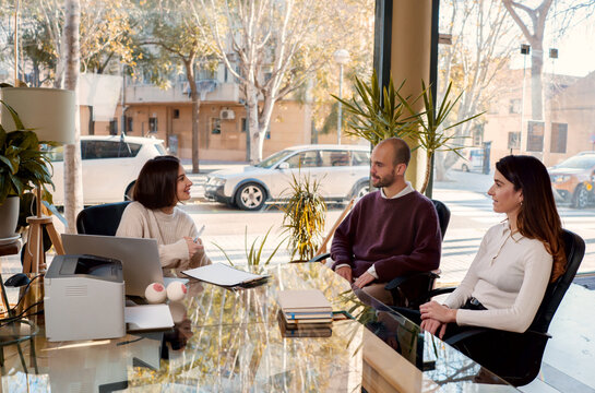 Content couple talking to sexologist during visit