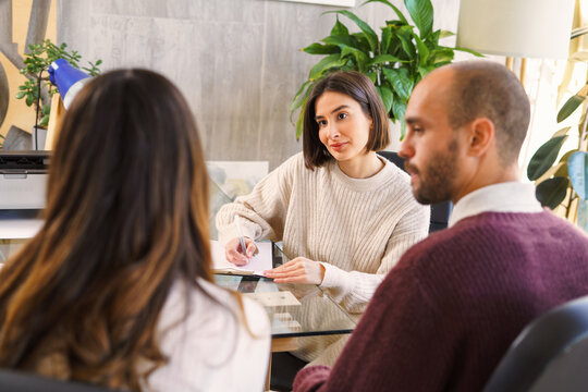 Couple talking to sexologist during meeting
