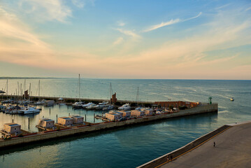 Fototapeta premium Aerial view of Rimini sea port with ships and blue water.
