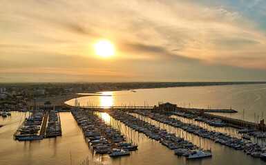 Obraz premium Aerial view of Rimini sea port with ships and blue water.