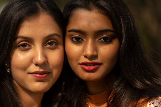 Close portrait of young Indian woman looking at camera
