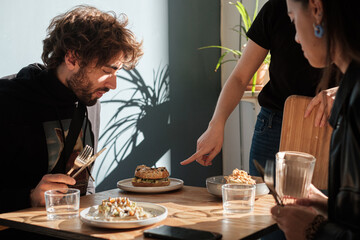 customers in a restaurant with food served