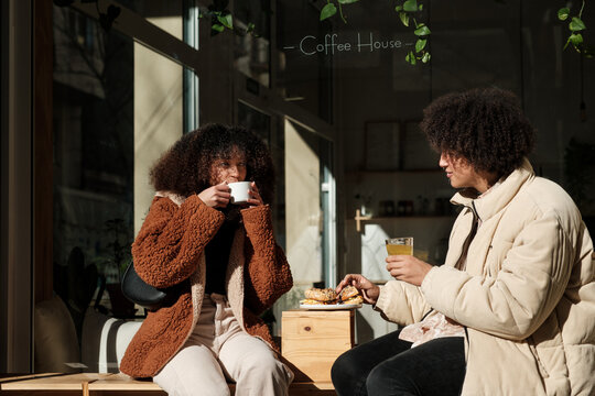 Couple having lunch at restaurant terrace