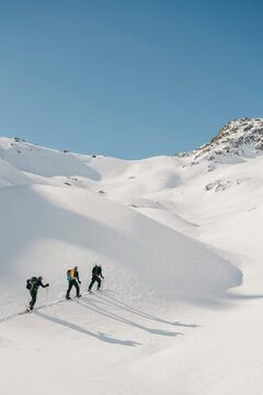 Backcontry skiers at sunny day