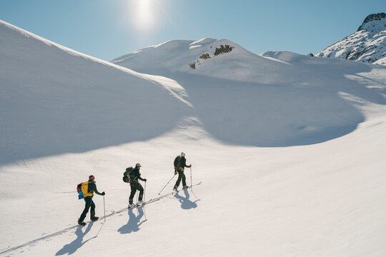 Backcontry skiers at sunny day