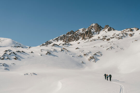 Backcontry skiers at sunny day