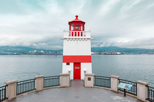 Lighthouse with red lines facing the sea