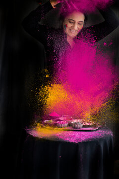 Woman Playing with Holi colors 