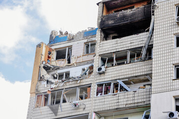 Kyiv, Ukraine, 17 March 2022: War of Russia against Ukraine. A residential building damaged by enemy aircraft in Ukrainian capital Kyiv, apartments destroyed following Russian rocket attack city