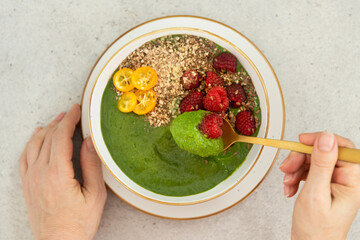 Strawberry, pineapple, spinach detox breakfast smoothie bowls