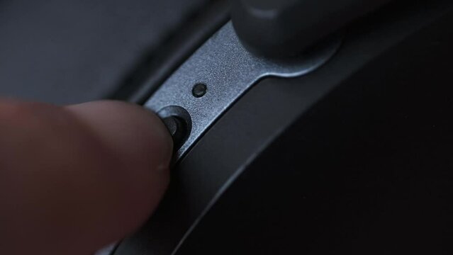Turning On Wireless Headphones by Pressing Button on the Headset, Blue Light Blinking