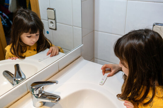 Little girl doing Covid antigen test