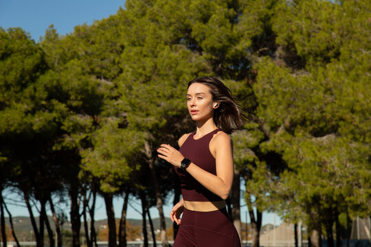 A sportive Woman running in a park