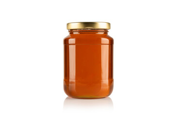 Glass jar with honey on white background.