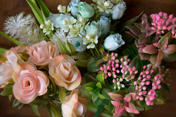 bouquet of pink, peach and blue flowers