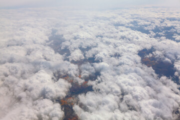 Flying over the white clouds . Flight above cloudscape