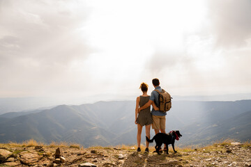 Happy couple in nature at sunset