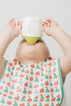 Baby Drinking Milk From A Sippy Cup