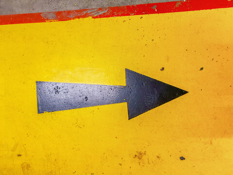 This Way, an arrow painted on the street