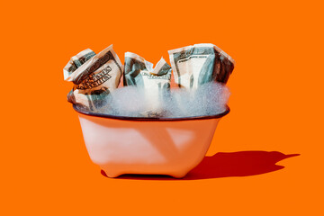 fake dollar bills soaking in a bathtub