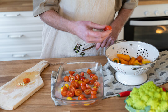 Senior man cooking preparing healhty meal in kitchen