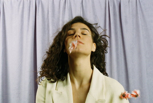 Portrait of a woman with flowers falling