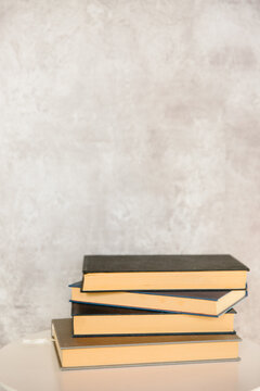 Hardback books on a table