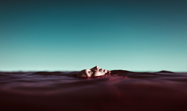 Woman's face floating on the sea surface
